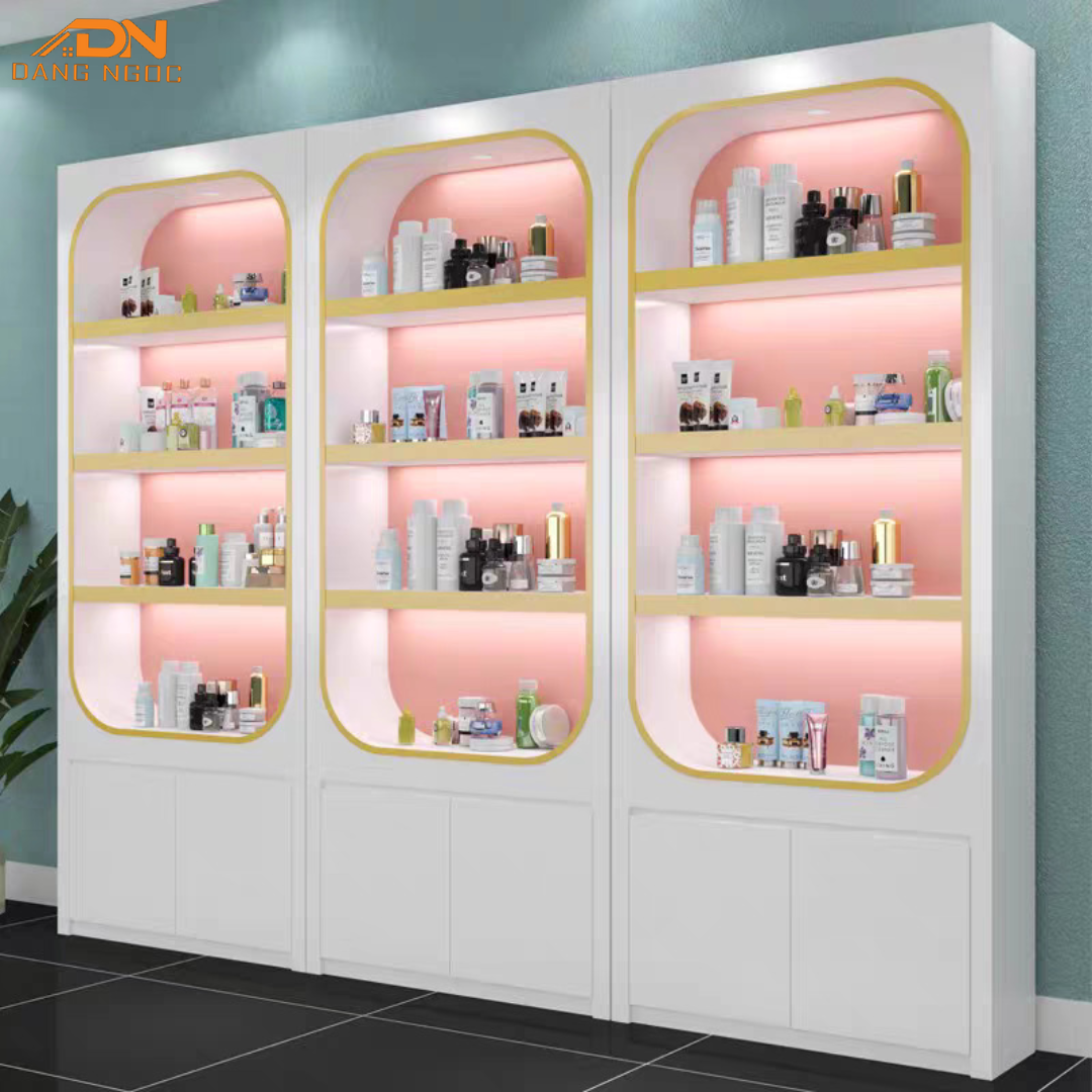 Hệ Tủ Trưng Bày Mỹ Phẩm Viền Vàng Nền Hồng Có Đèn LED Cao Cấp